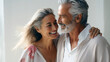 Beautiful gorgeous 50s mid age elderly senior model couple with grey hair laughing and smiling. Mature old man and woman close up portrait. Healthy face skin care beauty, skincare cosmetics, dental