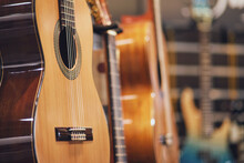 Acoustic Guitar In Music Shop, Close-up, Selective Focus On Musical Instrument
