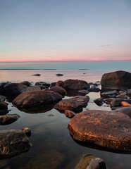 Wall Mural - Large lake stones in sunset colors