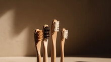 Eco-friendly wooden toothbrushes with natural bristles on beige studio background with copy space. Organic accessories for personal hygiene. 