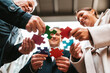 © alphaspirit - Businessmen working together to build a puzzle as teamwork, partnership and integration concept