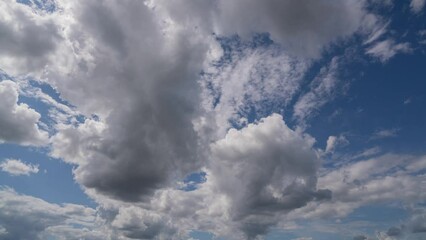 Wall Mural - blue sky white clouds. puffy fluffy white clouds. cumulus cloud cloudscape timelapse. summer blue sk