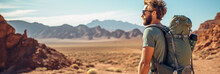 Male Hiker With Backpack Hiking In Mountain Desert Landscape 