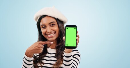 Poster - Pointing, green screen and woman with cellphone in studio with mockup space for marketing. Tracking markers, mobile and portrait of Indian model with phone website or chroma key by blue background.