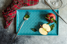 Tray With Fresh Apple With Cut Half Piece Fork And Knife In Daylight
