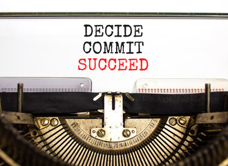 Wall Mural - Decide commit succeed symbol. Concept word Decide Commit Succeed typed on beautiful retro old typewriter. Beautiful white paper background. Business decide commit succeed concept. Copy space.