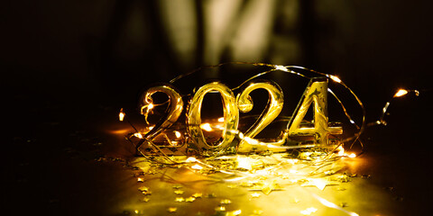 Wall Mural - Golden digits in 2024 number with gold decorations on dark background. 2024 new year backdrop. Space for text