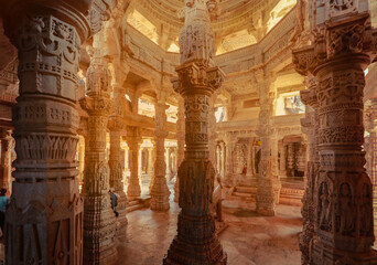 Wall Mural - Bas-relief at columns at famous ancient Ranakpur Jain temple in Rajasthan state, India