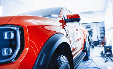 detailing of clean and shining polished red car