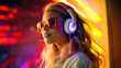 © Restyler - A bright multi-colored image of a woman wearing headphones in a nightclub. Modern pop music, female DJ.