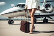 Stylish well dressed woman walking in front of private jet