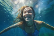 © Davidtarias - Girl diving with happy expression underwater