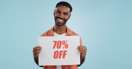 Wall Mural - Discount, sign and promotion, man and portrait, show information and smile isolated on blue background. Poster, billboard or banner with sale news, announcement on board with advertising in studio