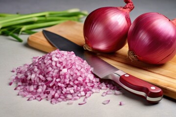 Canvas Print - knife and a pile of freshly chopped onions on a marble board