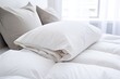© Alfazet Chronicles - a fluffed-up pillow and a folded duvet on a neat bed