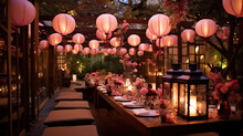 Japanese Style Wedding Reception With Low Dining Table, Floor Cushions, Paper Lanterns And Floral Decorations