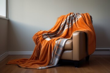 Wall Mural - a fleece blanket draped over a comfortable armchair