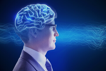 Side portrait of attractive young businessman with creative digital brain hologram on blue background. Hi-tech innovation and AI concept.