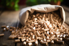 Sack of wood pellets spilled on rustic wooden floor, ecology concept, renewable energy, economy
