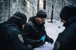 Officers conducting a tactical briefing in a snow-covered field, highlighting leadership and strategy. Generative Ai