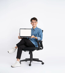 Wall Mural - Full body of young Asian man using laptop on white background