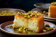 a plate of homemade kunafa with delicious cheese and pistachios