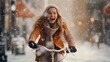 Joyful woman riding her bicycle through a winter urban cityscape. Snowflakes are falling around her, creating frosty scene. Happiness, confidence and careless freedom feeling in beautiful day.