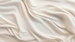 Whirls of pearl white and soft beige on a canvas. 