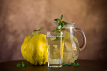 Wall Mural - Prepared compote from ripe natural autumn quince, in a glass glass and decanter .