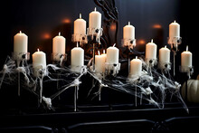 Burning White Candles On A Candlestick In A Spider's Web Burn In A Dark Room