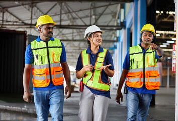 factory workers walking and talking about work or project in the warehouse storage