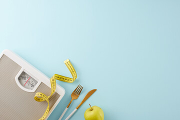 Weight shedding progress. Top view photo of weight scale, cutlery, tape measure, green apple on pastel blue background with advert area