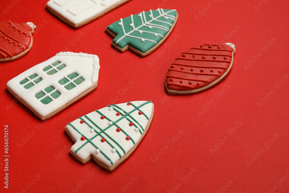 Set of sweet Christmas cookies on red background