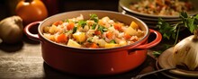 A Cozy Shot Of A Hearty Onion And Root Vegetable Stew Simmering In A Pot. The Onions Lend A Subtle Sweetness To The Dish, While The Carrots, Pars, And Potatoes Create A Comforting Medley