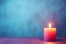 A Single Candle Placed Gently, Hope Symbol. Burning Candle On Colorful Gradient Background