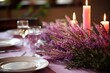 Table setting with purple heather centrepiece