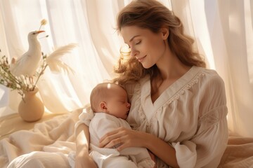 A loving mother takes care of her newborn baby at home. A bright portrait of a happy mother holding a sleeping baby in her arms. Mother hugging her little child