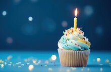 Cupcake With Lit Candle On Blue Background, Birthday And Celebration. Generative AI