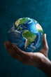 © Ricardo Costa - Hand holding a blue earth globe