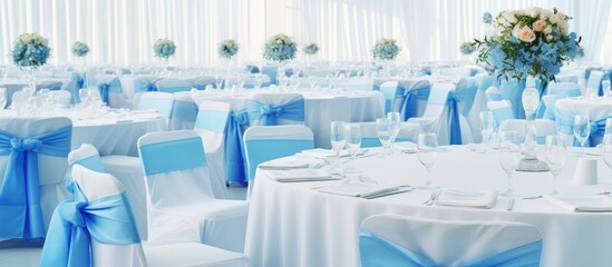 Poster - Blue clothed round tables fill a white wedding pavilion