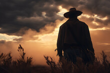 Silhouette Of A Cowboy At Sunset