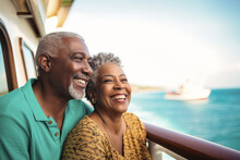 An Elderly Dark-skinned Couple On The Deck Of A Ship Or Liner Against The Backdrop Of The Sea. Happy And Smiling People. Travel On A Sea Liner. Love And Romance Of Older People