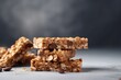 Stack of tasty granola bars on light grey table close up view 