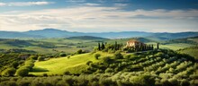 Panoramic View Of Maremma Countryside With Olive Trees Rolling Hills And Green Fields With The Sea On The Horizon In Casale Marittimo Tuscany Italy Europe
