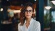 © Restyler - Businesswoman in a business suit and glasses. Portrait of a business lady. Successful woman.