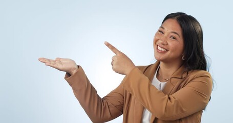 Canvas Print - Business woman, palm and studio presentation for product marketing, information or professional offer. Happy face of an asian employee hands, pointing to design and mockup space on a blue background