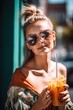 portrait of an attractive young woman enjoying a smoothie on a sunny day