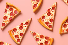 pepperoni pizza slices pattern on a pastel pink background, flat lay
