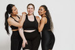© Drobot Dean - Three positive women with different body types posing together isolated over white background