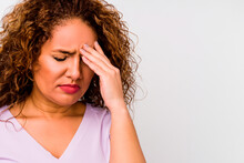 A Woman In Her Forties With Curly Blonde Hair With A Severe Headache
